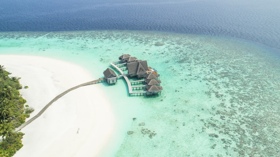 Couple dining on a private beach at sunset in the Maldives